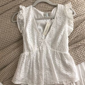 White peplum style top